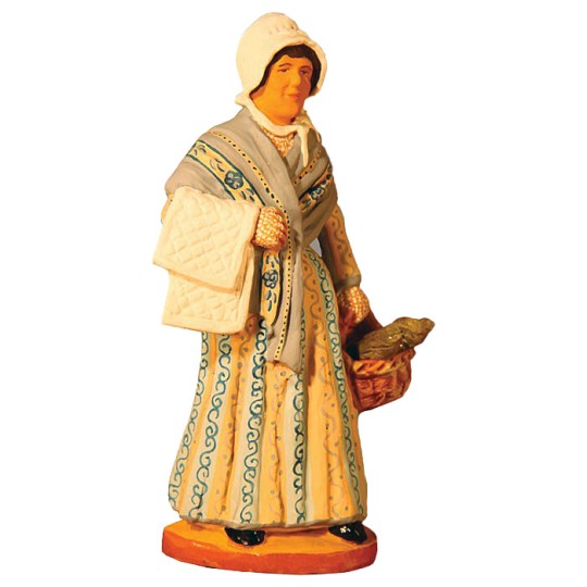 image: Woman carrying swaddling clothes