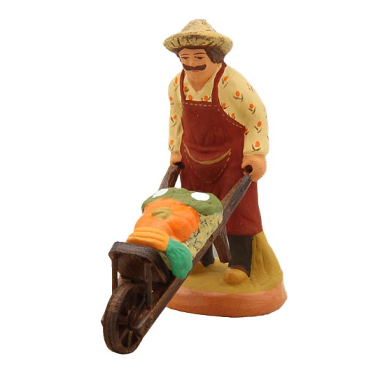 image: Gardener with vegetables on wheelbarrow