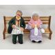 Grand-parents sitting on a bench with cat 9 cm