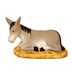 image: Donkey laying on strow