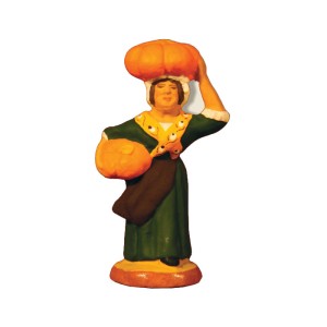 image: Woman carrying pumpkins