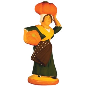 image: Woman carrying pumpkins